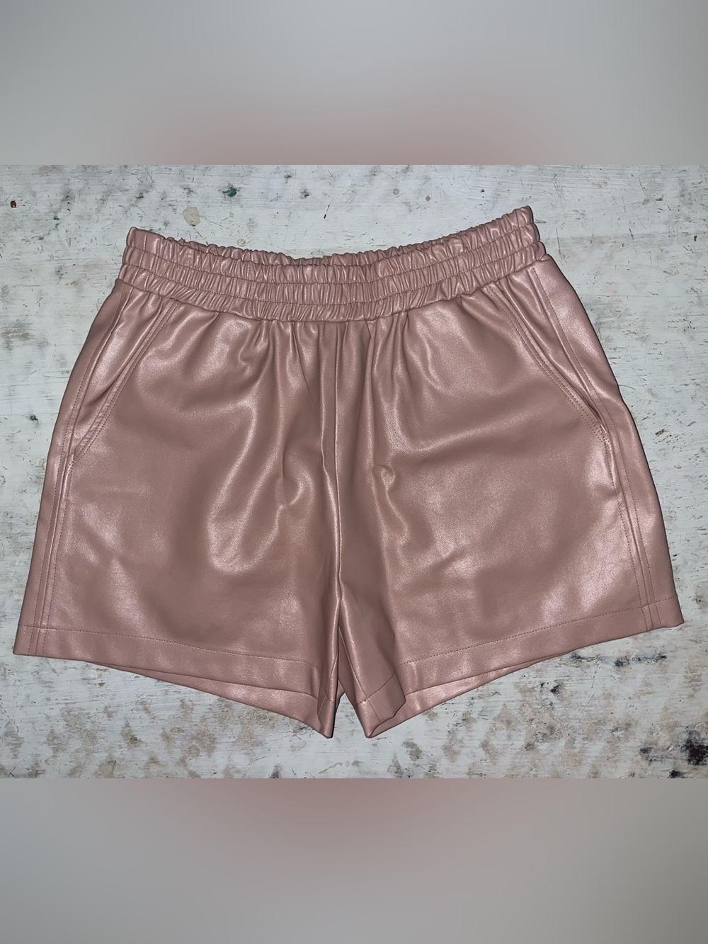 Amanda Uprichard Mariko Faux Leather Shorts in a soft blush pink shade | small